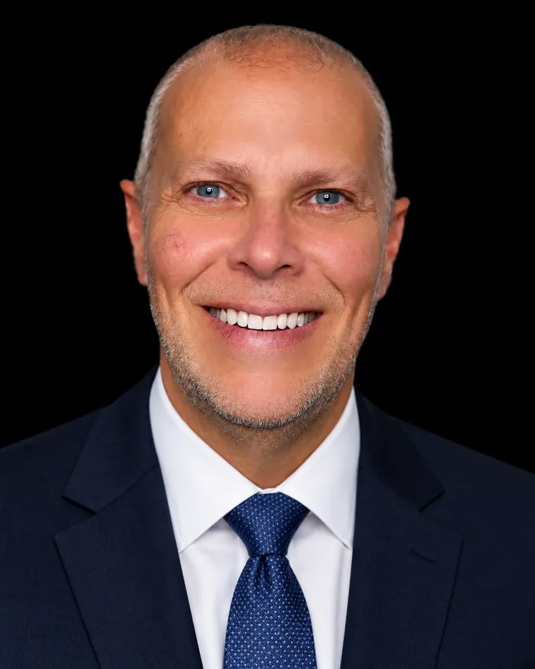 Mike Bayer, Fiduciary Wealth Advisor, in a navy suit and tie